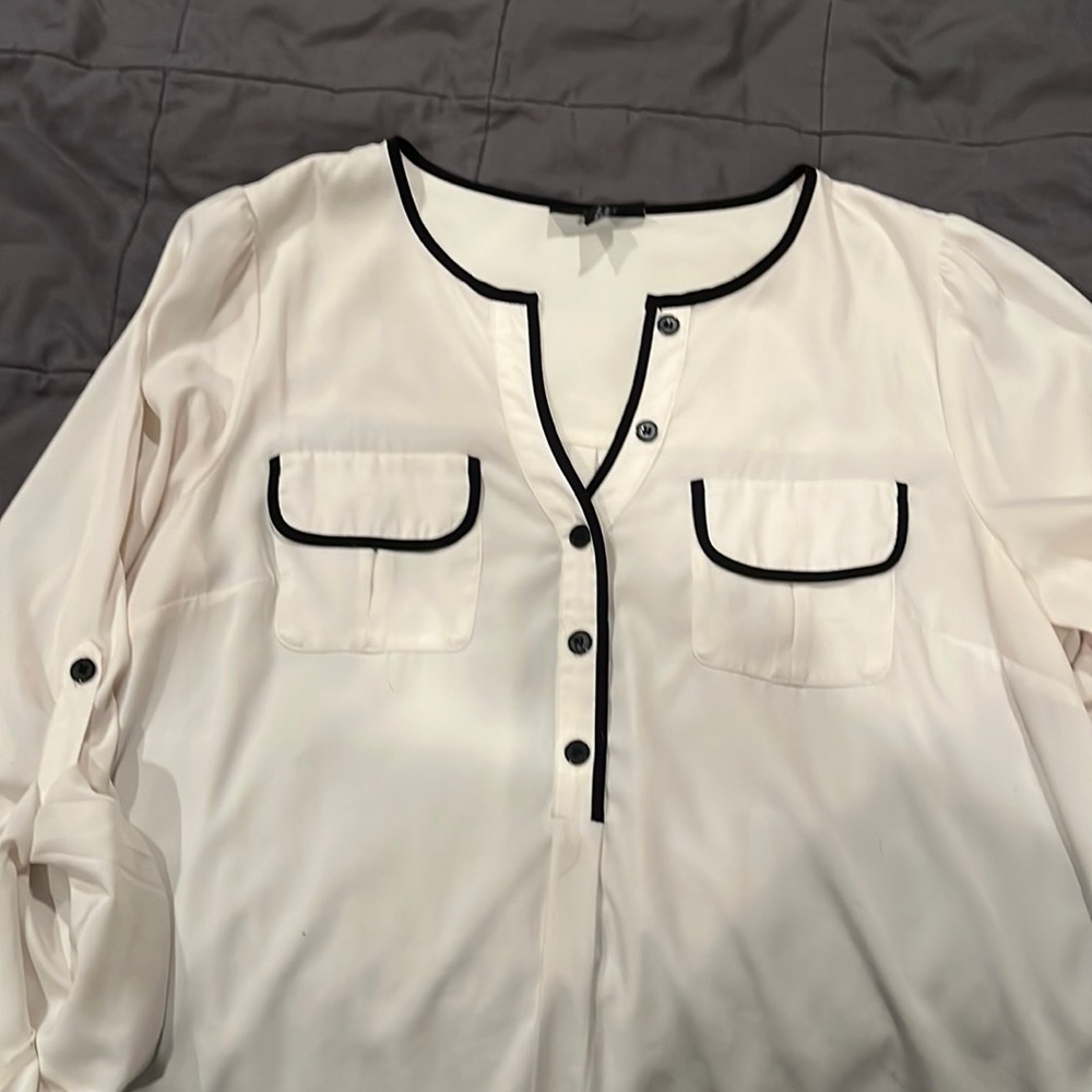 Cream blouse with black trim
